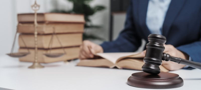 A Florida criminal defense attorney reading a law book at their desk