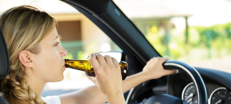 Underage female in car drinking alcohol.